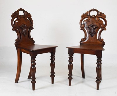 Lot 708 - Pair of Victorian mahogany hall chairs
