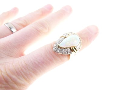 Lot 27 - Opal and diamond cluster dress ring