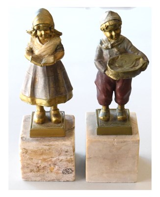 Lot 297 - Pair of Dutch-style gilt figures on marble bases