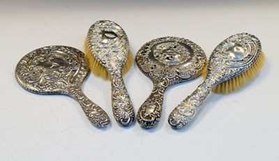 Lot 179 - Pair of George V silver-mounted brushes together with two similar silver-mounted hand mirrors