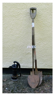 Lot 809 - Small black painted water pump and two shovels