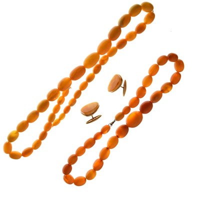 Lot 77 - Two graduated amber bead necklaces, and a pair of amber set cufflinks