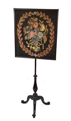 Lot 564 - Embroidered mahogany polescreen