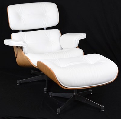 Lot 522 - Modern Eames style armchair and stool