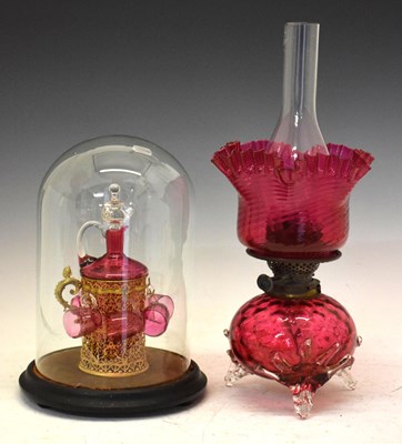 Lot 458 - Cranberry glass liqueur set under dome, plus cranberry lamp