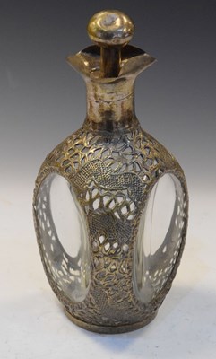 Lot 295 - Chinese decanter of dimple form with pierced silver plated decoration of dragons