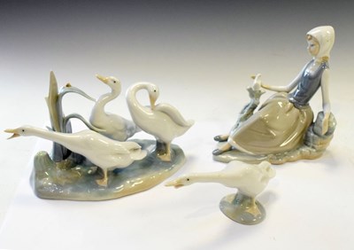 Lot 444 - Lladro lady figure, group of three geese, and single